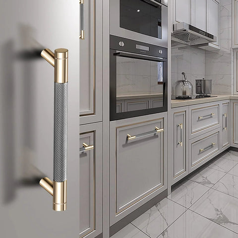 12 Pack 3 Inch Barrel Cabinet Pulls Gold And Grey Aluminum Handles For Cabinets And Drawers in a kitchen setting