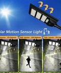 Dusk To Dawn Solar Street Light 50000LM With Motion Sensor Lit Outdoor LED Flood Light on pole, showing brightness levels.