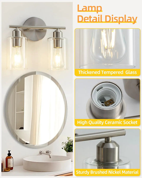 Sleek Two Light Brushed Nickel Vanity Light Fixture Over Mirror With Clear Glass Shades shown in bathroom setting