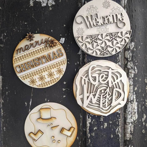 Round Baltic birch plywood Christmas ornaments set of 4 with laser-cut designs including Merry Christmas Welcome snowman
