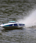 Sonicwake V2 36 Inch Self Righting Brushless RC Boat With Deep V Hull speeding on water, white color, showing splash.