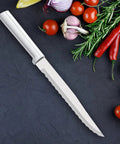 Smooth Serrated Slicer Knife With Knockout Double Sided Teeth That Crush Through Tough Produce Skins Like Hot Knife on a dark background with fresh vegetables.