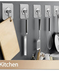 Heavy Duty Self Adhesive Hooks 27 Pack Up To 25 Lb Capacity Stainless Steel Sticky Hangers holding kitchen utensils