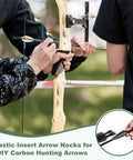Archers installing Plastic Arrow Nocks For Archery 3.2mm ID 0.13 Inch Insert Double Lock Nocks on a yellow compound bow outdoors