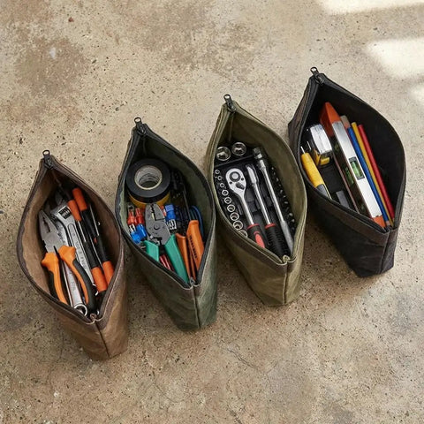Waxed Canvas Tool Pouches 4 Pack, 11-Inch Heavy-Duty Zipper Tool Bags Set with tools and accessories on concrete surface.