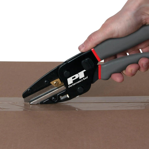 Three In One Power Cutting Tool That Works As A Wire Cutter, Box Cutter And Utility Knife being used to cut cardboard tape