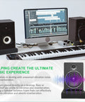 Studio monitor on isolation pads with keyboard and computer displaying music software, highlighting Two Pack Studio Monitor Isolation Pads For 3 To 4.5 Inch Speakers High Density Acoustic Foam To Cut Vibration And Improve Crisper Sound Quality 8 X 6.3 X 1.4 Inch Cushions For Desk Or Stand Mount