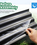 Peeling off protective film from Self Watering Galvanized Raised Garden Bed Kit For Veggies Herbs And Flowers With Mesh Cover In A Large Oval Metal Outdoor Planter Box Six Foot By Three Foot By One Foot panel