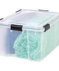 Legit Heavy Duty Stackable Storage Tote Bins 8 Pack 62.8 Quart Clear Black Plastic Gasket Boxes with blanket inside
