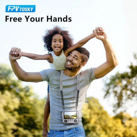 Man wearing soft leather lanyard for DJI RC Series remotes, playing with child outdoors. Text reads: 'Free Your Hands.'