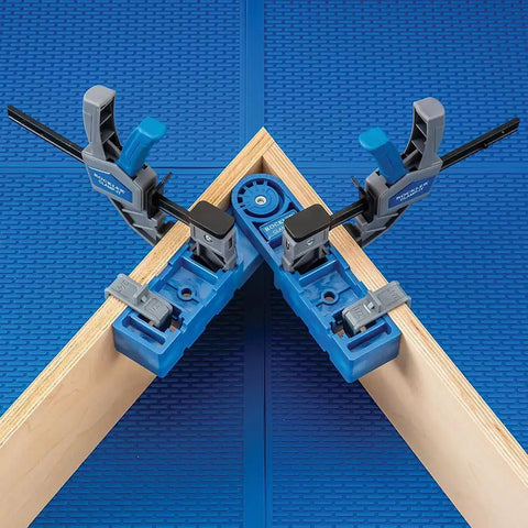 Versatile Adjustable Assembly Square Clamp For Woodworking From 45 To 315 Degrees holding wood boards at an angle on blue surface