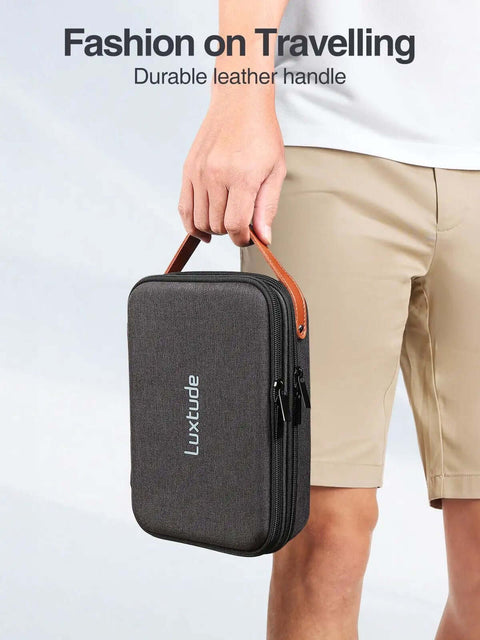 Premium Electronics Organizer Travel Case Featuring Rugged Hard Shell Exterior And Ergonomic Handle, held by a person.