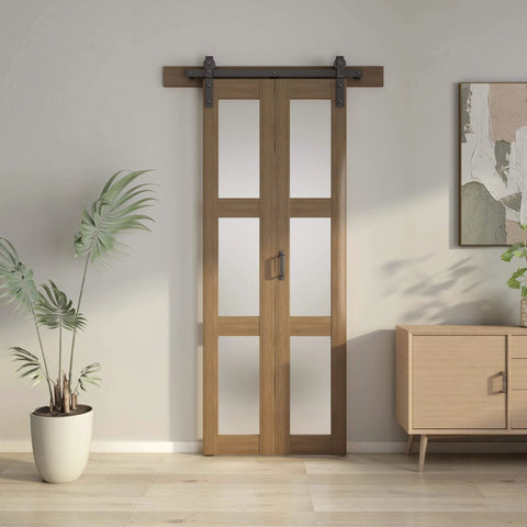 32 Inch Bifold Glass Barn Door Kit With Hardware Included, solid wood slab with frosted glass, installed in a living room.