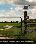 Game Changing Solar Automatic Gate Opener Designed For Heavy Duty Outdoor Chain Link And Wood Gates Up To Sixteen Feet With Slick Remote Controller Full System Kit installed on a fence.