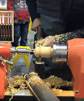 Woodworker using the Top Notch Eight Piece Wood Lathe Chisel Set Featuring Razor Sharp High Speed Steel Blades for turning wood.