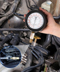 Jiimee 0-140 PSI fuel pressure tester gauge with brass adapters installed in a diesel engine fuel line