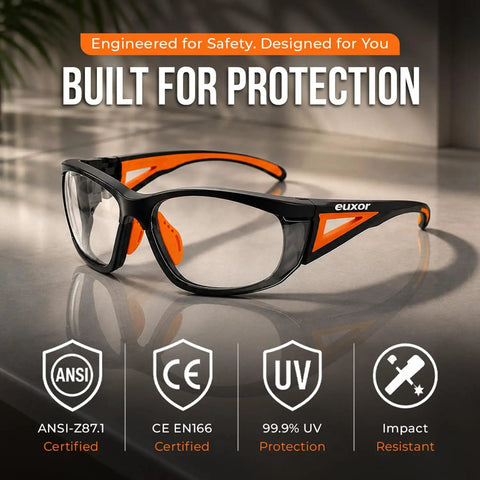 Top Shelf Industrial Safety Glasses With Vibrant Orange Frame Clear Anti Fog Lenses Scratch Resistant High Impact Shield ANSI Z87 Certified UV400 Eye Protection Clutch For The Job Site Bad Boy Gear on a countertop.