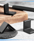 Give Your Floors A Sweet Makeover With These 8 Piece Rubber Bed Frame End Caps 1.5 Inch L Shape Angle Iron Covers Black Anti Slip Heavy Duty Furniture Leg Protectors For Metal Shelves Home Office on black stone surface.