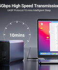 Top Rack Dual Sata Hard Drive Enclosure With Raid Disk Array And Quiet Cooling Fan USB3.0 connected to a laptop showing high speed data transfer.