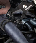 Toolwiz swivel-clamp pliers installing a black 6–25mm spring hose clamp on a car radiator hose