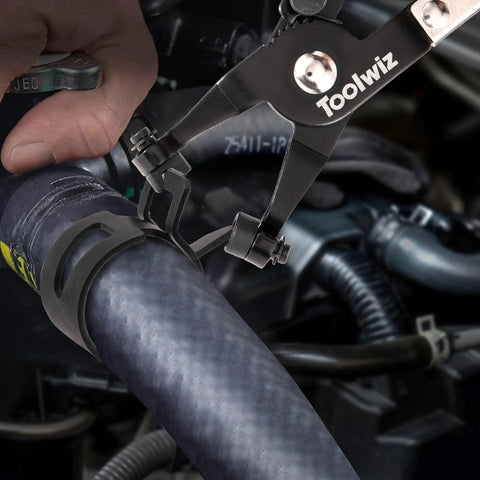 Toolwiz swivel-clamp pliers installing a black 6–25mm spring hose clamp on a car radiator hose