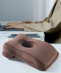 Office Napping Pillow For Neck Support, Ultra Lightweight And Comfy, Travel Friendly Desk Pillow For Naps And Air Travel in brown velvet on desk