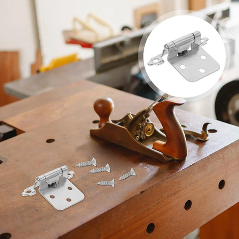 10 Pack Half Overlay Spring Cabinet Hinges, 1.2mm white nickel metal on workbench with screws, soft close feature