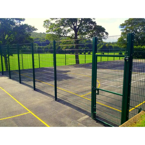 Green wire mesh fence made with Fully Automatic Wire Mesh Welding Machine For Reinforcing Wire Cloth, enclosing a park area.