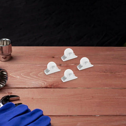 Four Piece Fixed Caster Wheels For Furniture And Cabinets, Durable Non Swivel Polypropylene Rollers on wooden table.