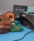 Heavy Duty Soldering Fume Extractor With Beast Mode Adjustable Blower And Top Shelf Particle Control For Single Workbench Setup used during circuit board assembly.