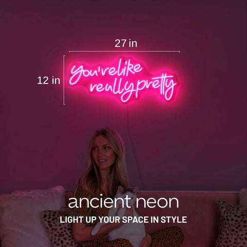 Pink Led Neon Sign Youre Like Really Pretty With Safe Acrylic Backing Large Wall Decor, lit in bedroom with woman underneath