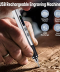 Person using Upgrade 2 Way Rotary Electric Engraving Pen With 37 Bits Cordless USB Rechargeable for engraving wood detail.
