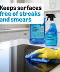 Person cleaning glass surface with Streak Free Glass Cleaner For Mirrors And Windows, 32 Fl Oz Bottles, Pack Of 2 With Sprayer.
