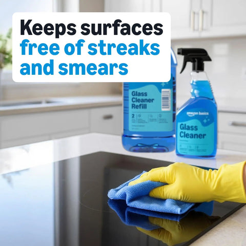 Person cleaning glass surface with Streak Free Glass Cleaner For Mirrors And Windows, 32 Fl Oz Bottles, Pack Of 2 With Sprayer.