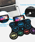 Roll Up Electric Drum Set With 9 Pads For Kids, MIDI Jam Ready Drum Pad Kit shown with phone stand and USB connection