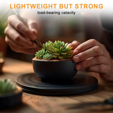 Person arranging succulents on 8 Inch Heavy Duty Turntable Stand With Non Slip Swivel Base And Steel Ball Bearings, 360 Rotation.