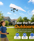 Young boy flying DIY Paper Airplane RC Kit For Grownups Build A Motorized Remote Control Paper Plane With Propeller outdoors
