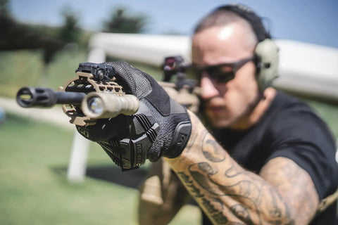 Person aiming a rifle wearing M-Pact 0.5mm High-Dexterity Covert Tactical Work Gloves With Touchscreen Capability