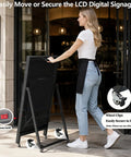 Woman securing a portable 43 Inch Indoor Digital Signage Display Portable Lcd Menu Board with wheel clips outdoors.
