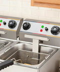 Two stainless steel deep fryers with temperature dials and indicator lights in a commercial kitchen setting.