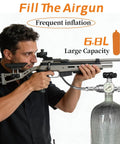 Man using 6.8L PCP Air Tank System for Paintball and HPA Scuba Gear with carbon fiber tank and dual gauge valve