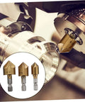 Flute steel chamfering cutter set (3 pcs) with square shanks; gold-tone HSS milling tools installed on a lathe.