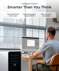 Man using SafetyPro AP2 Smoke Purifier for Laser Engravers and CO2 Cutters in home office with computer and blinds.