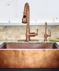 Cold Water Kitchen Water Filter Faucet Brass Body In Antique Copper Finish, close-up on sink with high arc spout and 360 rotation