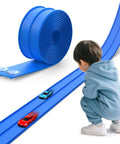 Child playing with 15 Ft Flexible Race Track Kit For 1:64 Diecast Cars, showing DIY setup with suction cup ramp and diecast cars.
