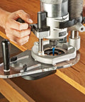 Universal Offset Router Base Plate For Precision Woodworking clear acrylic foot mounted under router for steady cutting on wood.