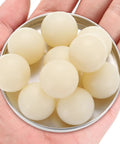 Twenty Pack Nylon Bearing Balls One Inch Diameter Solid Plastic Sphere Precision Engineering Grade in a hand.