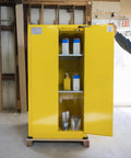 Heavy Duty 60 Gallon Flammable Safety Cabinet With Automatic Door displaying yellow storage with paint cans inside.
