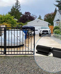 Heavy Duty 7 Inch Gate Hinges 2 Pack Black Iron Barrel Style Weld On For Swing Gates Trailer Ramp Gates And Doors 900 Lb Capacity Durable Cold Rolled Steel Hinge Set For High Load Applications installed on a driveway gate.
