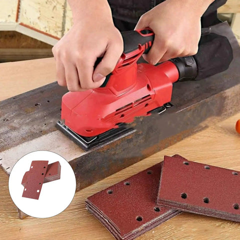 Person using Premium Grit Aluminum Sanding Discs With Eight Holes For Grinding Wood Metal And Aluminum on wooden surface.